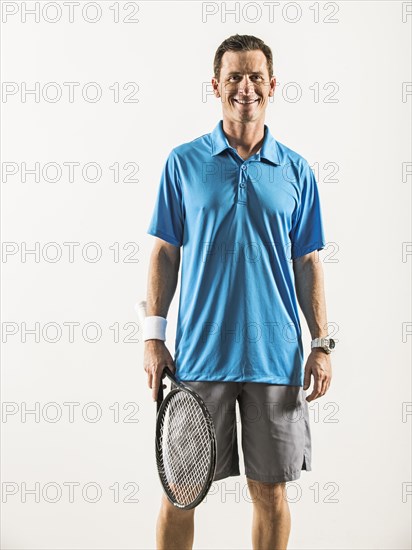 Caucasian tennis player smiling