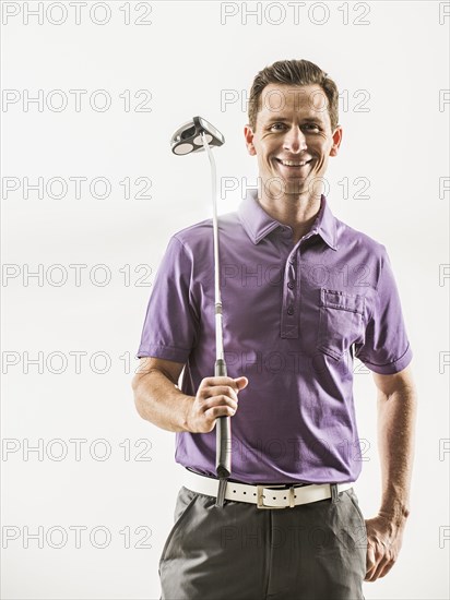 Caucasian golf player smiling