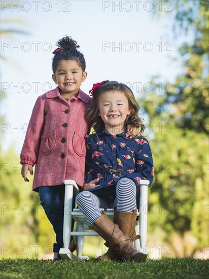 Mixed race girls smiling together outdoors