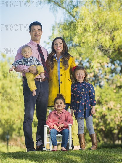 Family smiling together outdoors