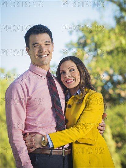 Couple hugging outdoors