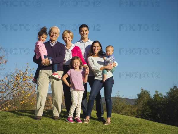 Family smiling together outdoors
