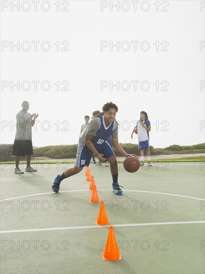 Basketball team doing drills at practice