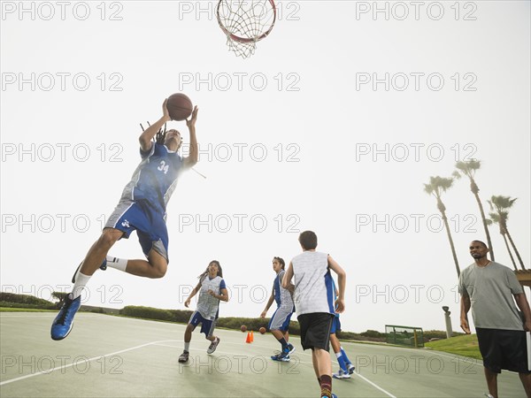 Basketball team doing drills at practice