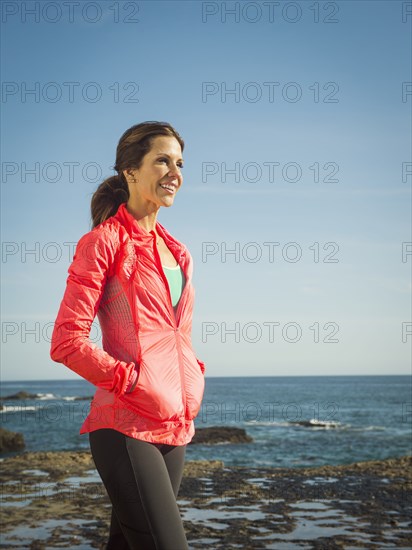 Caucasian woman walking on beach