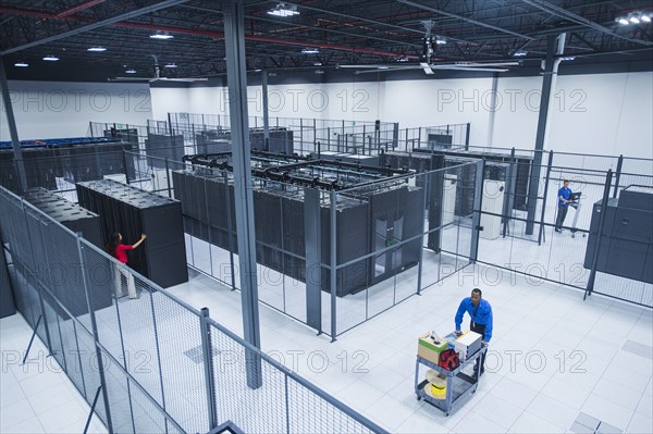 High angle view of Black businessman working in server room