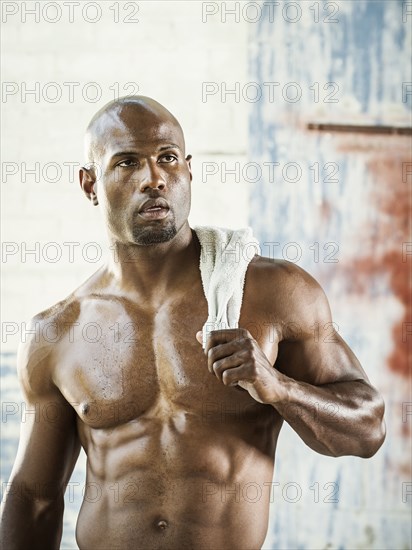 Black athlete holding towel