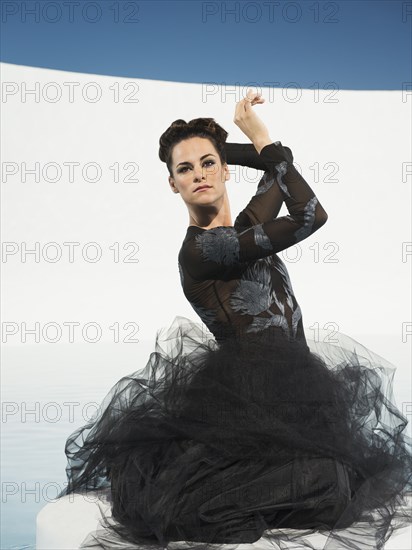 Caucasian woman posing in evening gown