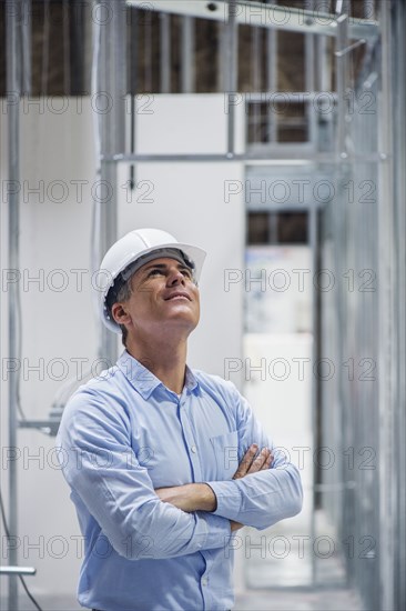 Caucasian architect admiring construction site