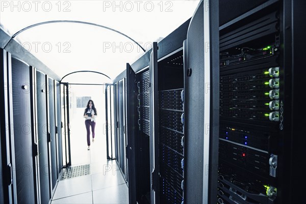 Technician walking in server room