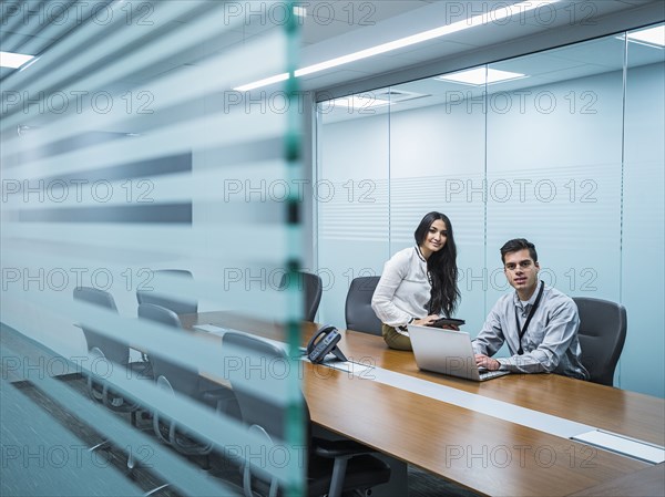 Business people smiling in conference room