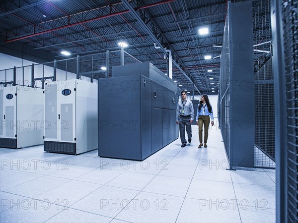 Technicians walking in server room