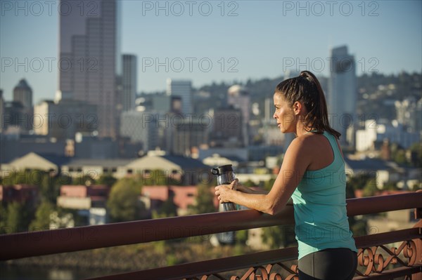 Caucasian woman admiring Portland cityscape