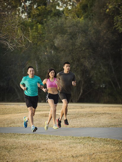 Chinese friends jogging in park