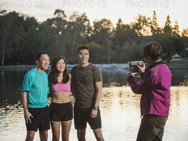 Chinese family taking photograph in park