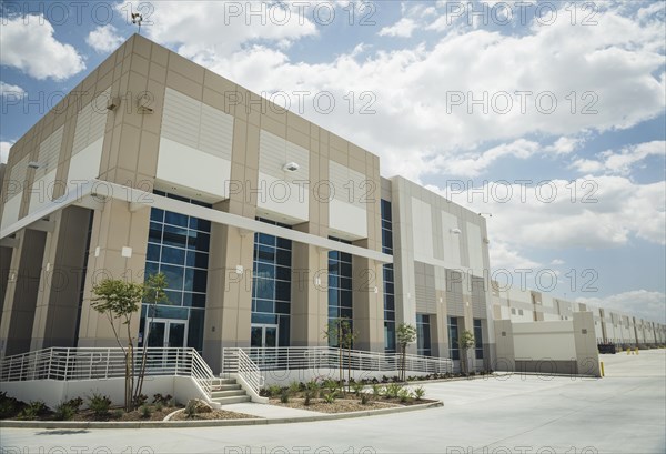 Parking lot outside modern office building