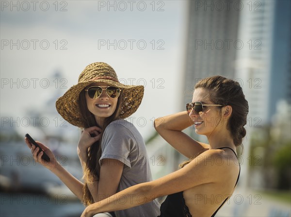 Caucasian women leaning on railing