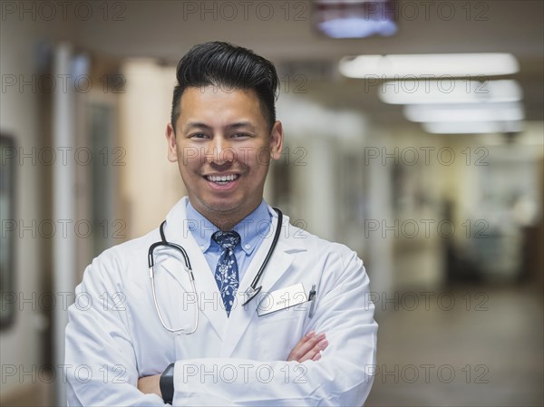 Portrait of confident Filipino doctor