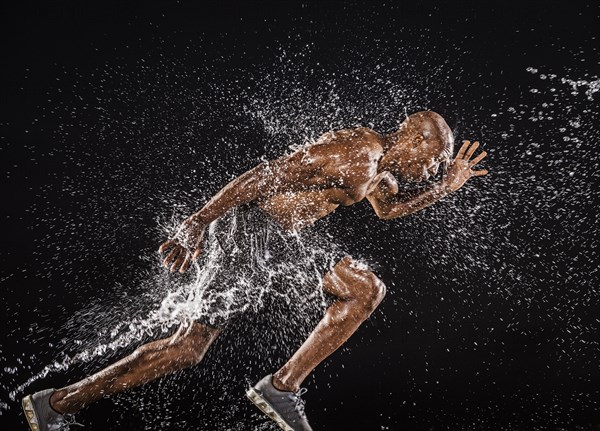 Water splashing on black runner