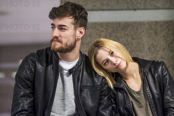 Caucasian woman leaning head on shoulder of man