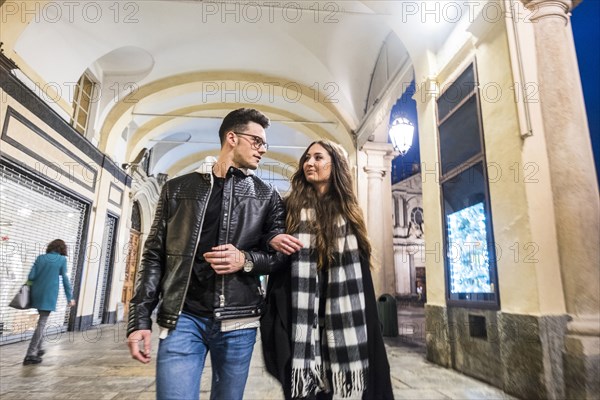 Caucasian couple walking in lobby