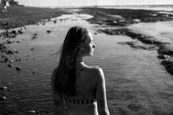 Caucasian woman relaxing on beach