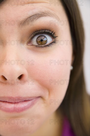 Close up of grinning Hispanic woman