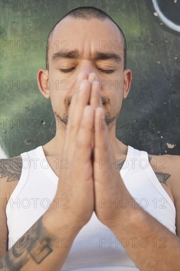 Hispanic man praying