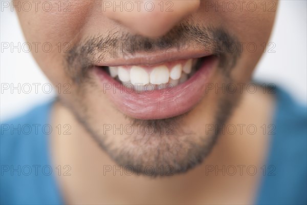Close up of Hispanic man's mouth and goatee