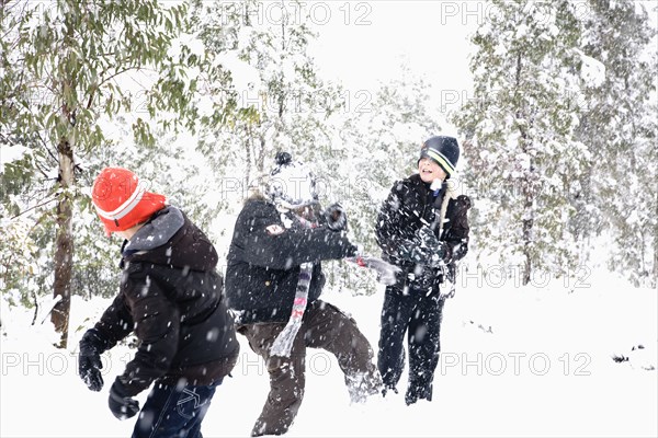 Hispanic children playing in snow