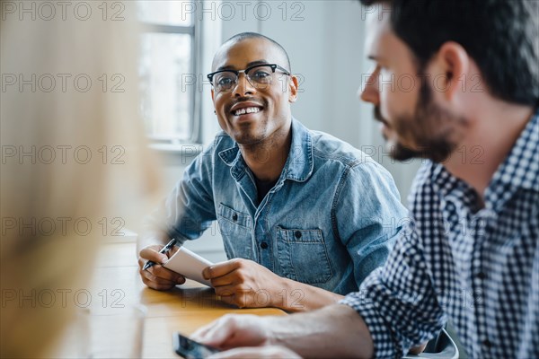 Businessman listening in meeting