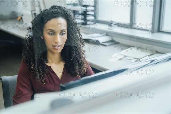 Portrait of serious mixed race businesswoman