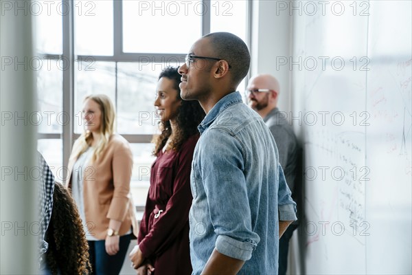 Business people near whiteboard