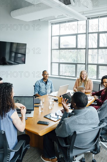 Business people smiling in meeting