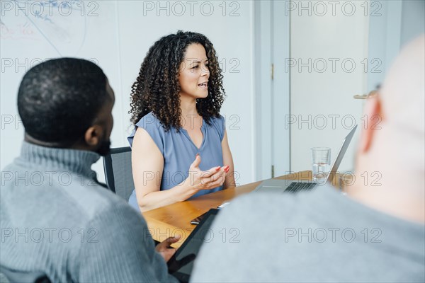 Businesswoman gesturing in meeting