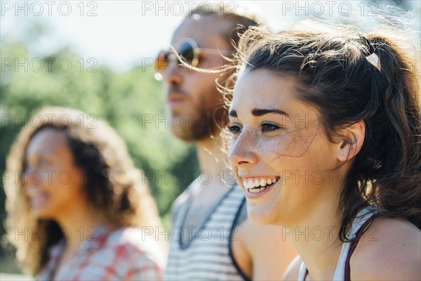 Close up of smiling woman with friends