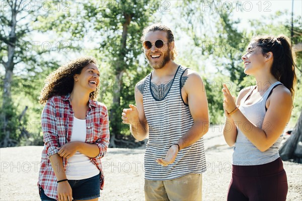 Friends laughing outdoors