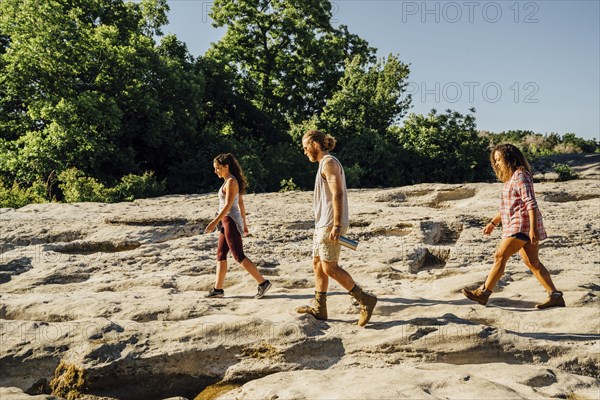 Friends walking on rocks