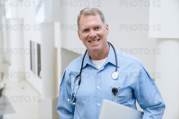 Portrait of smiling Caucasian doctor