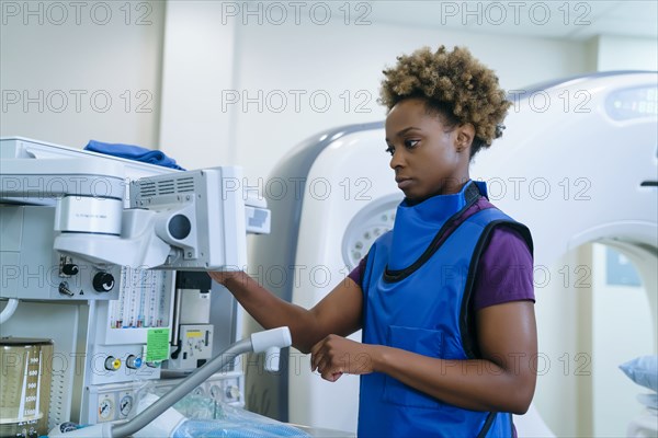 Black hospital technician wearing protective vest