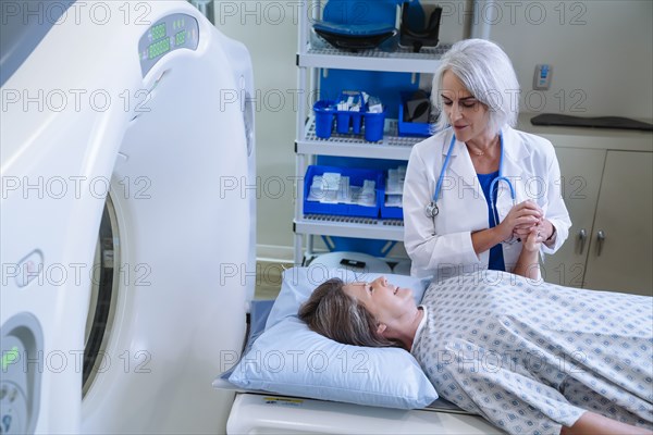 Black hospital technician wearing protective vest