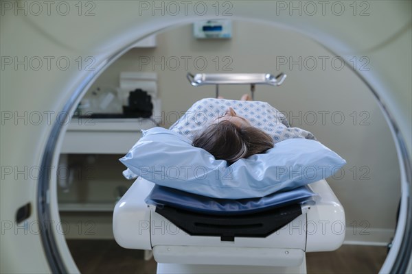 Caucasian patient laying on scanner table