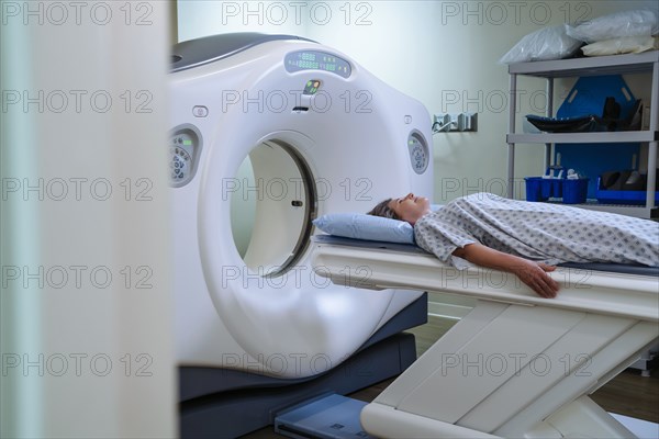 Caucasian patient laying on scanner table