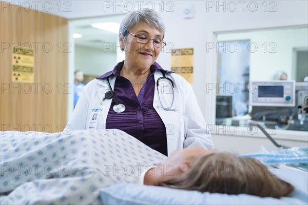 Doctor talking to patient at scanner