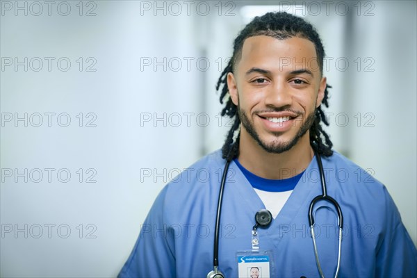 Portrait of smiling mixed race nurse