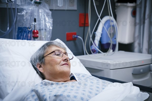 Mixed race patient in hospital bed