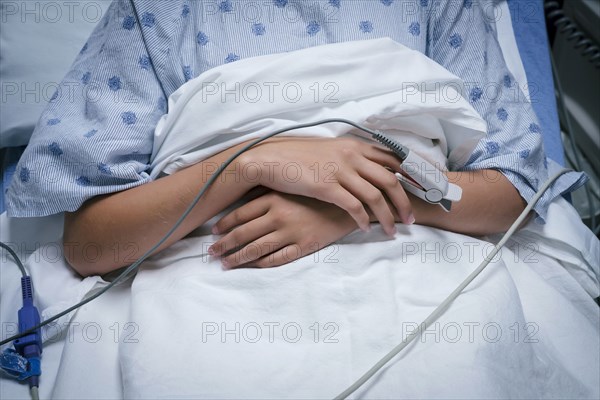 Monitor on finger of Caucasian girl in hospital