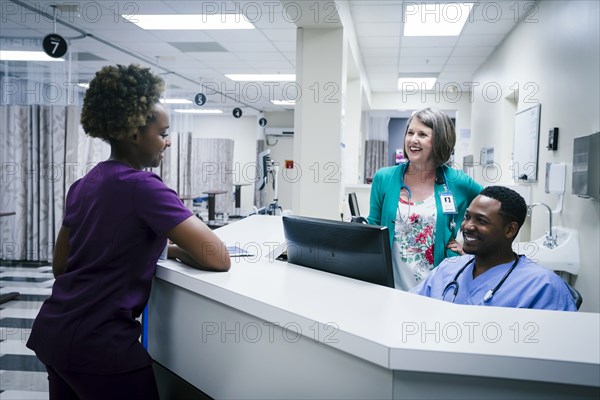Doctor and nurses talking in hospital