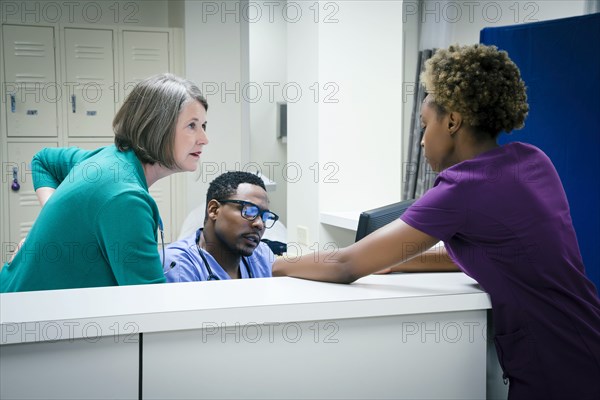 Doctors and nurses talking in hospital