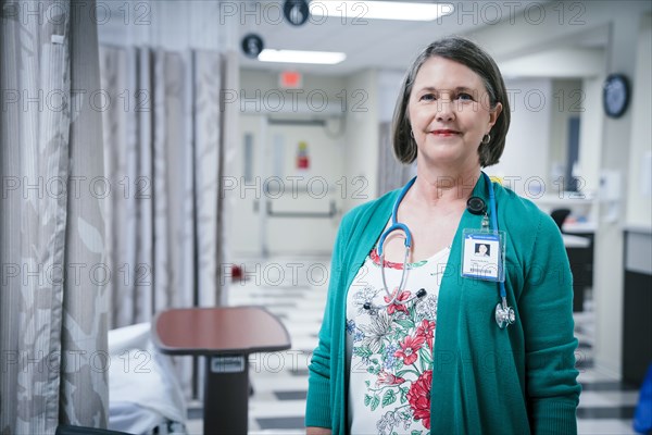 Portrait of smiling Caucasian doctor in hospital